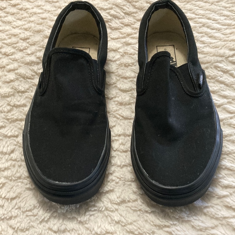 Black Vans slip ons